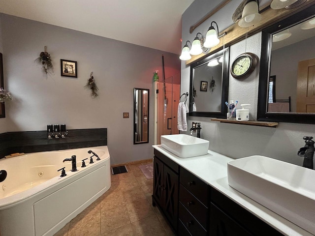 bathroom featuring tile patterned flooring, a sink, a jetted tub, and double vanity