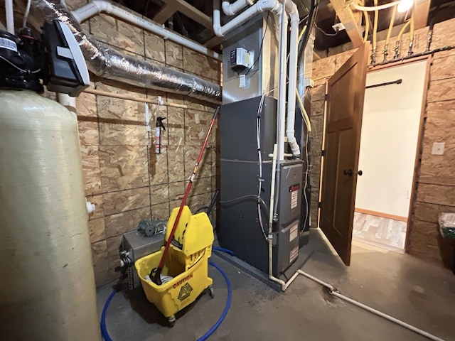 utility room featuring heating unit