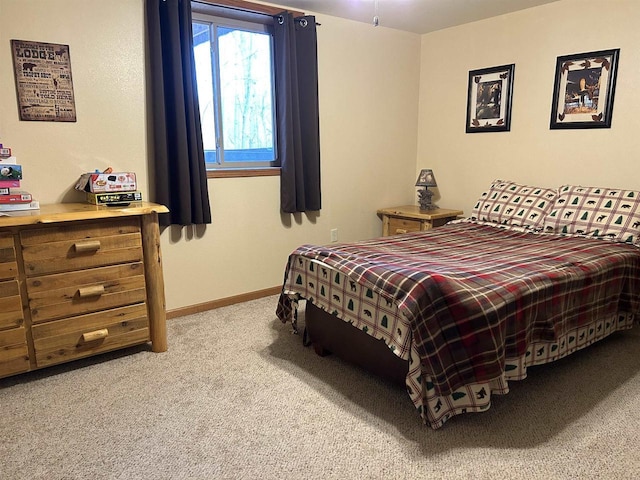 carpeted bedroom with baseboards