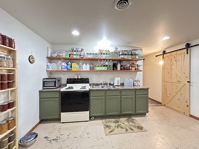 kitchen featuring green cabinetry, visible vents, electric range, and a barn door