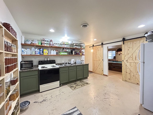 kitchen featuring freestanding refrigerator, electric range, green cabinets, and a barn door