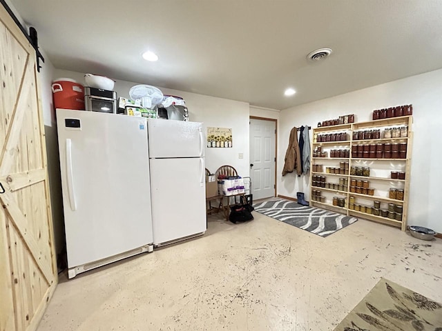 interior space with recessed lighting, visible vents, and freestanding refrigerator