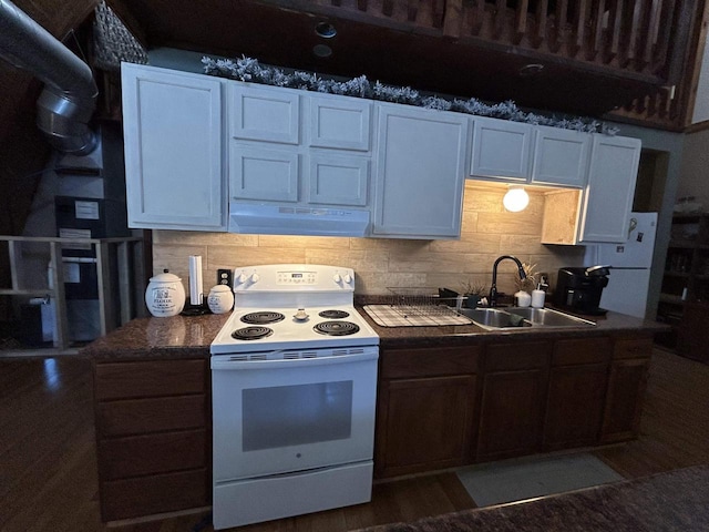 kitchen featuring electric stove, white cabinetry, and under cabinet range hood