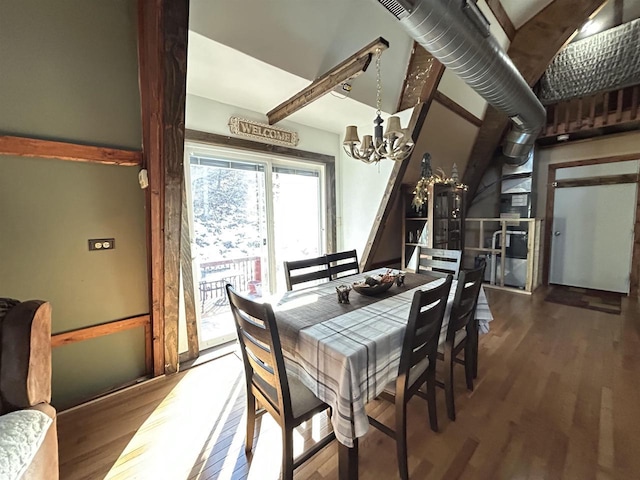 dining room featuring an inviting chandelier and wood finished floors