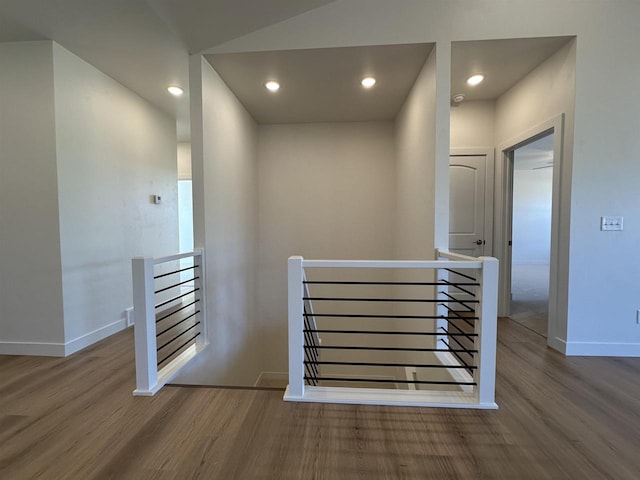 stairs featuring hardwood / wood-style floors