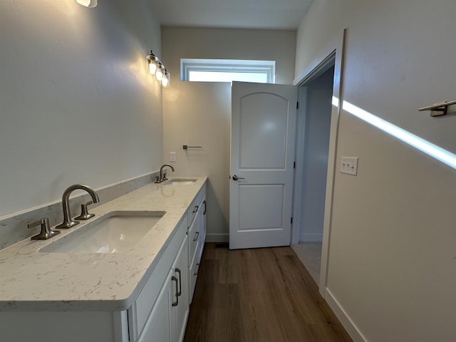 bathroom featuring vanity and wood-type flooring