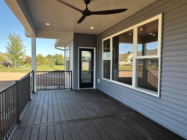 wooden deck featuring ceiling fan