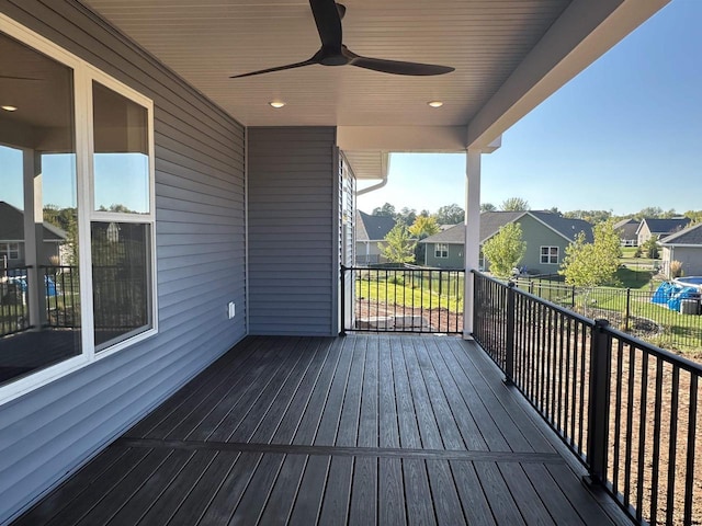 wooden deck featuring ceiling fan