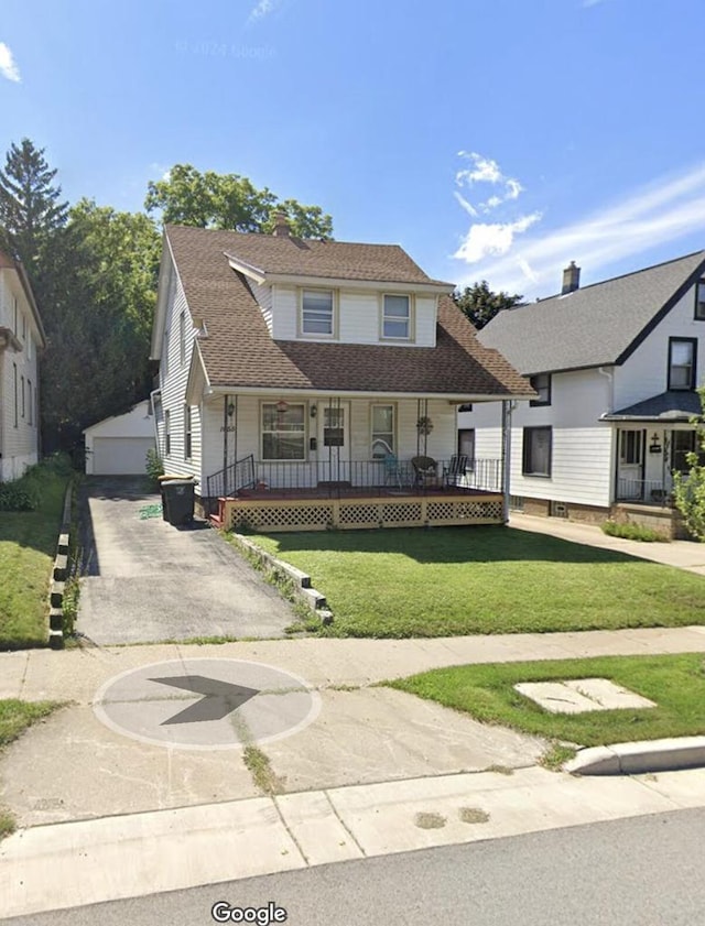 view of front of home with a garage, an outdoor structure, a porch, and a front lawn