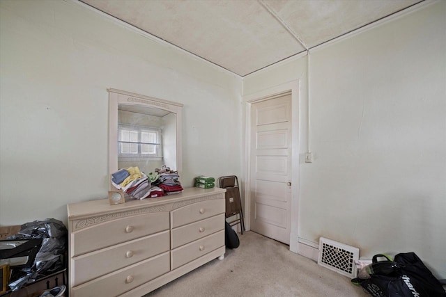 bedroom with light colored carpet