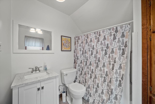 bathroom with vanity, toilet, curtained shower, and vaulted ceiling