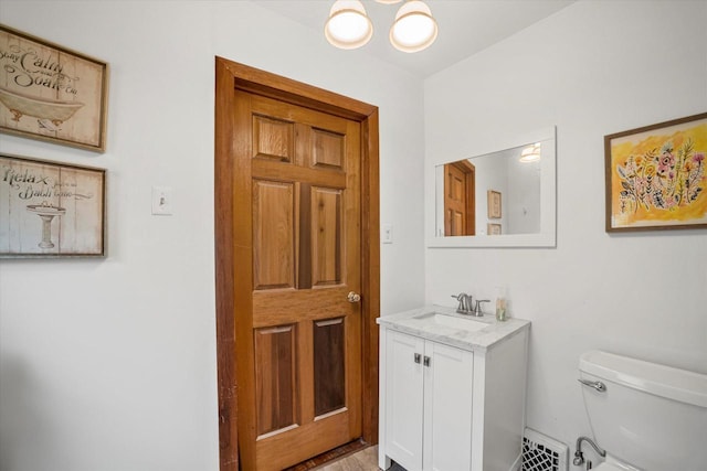 bathroom with vanity and toilet