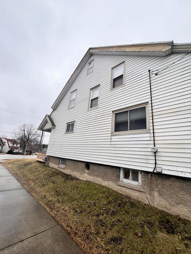 view of property exterior featuring a yard