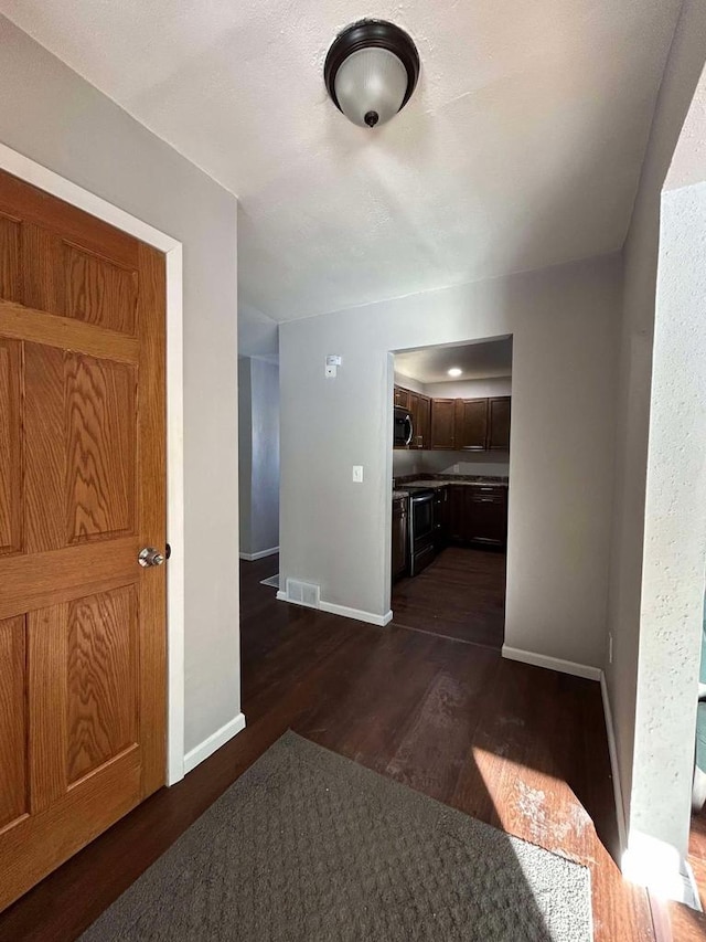 hall featuring dark hardwood / wood-style flooring