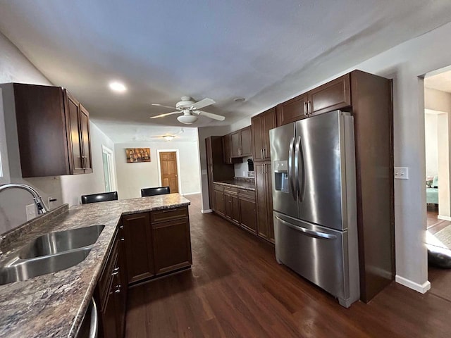 kitchen with stainless steel refrigerator with ice dispenser, sink, ceiling fan, and dark hardwood / wood-style floors