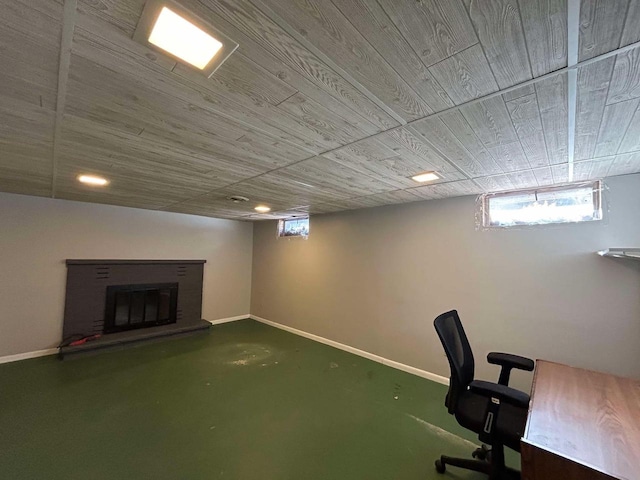 interior space featuring a brick fireplace and wooden ceiling