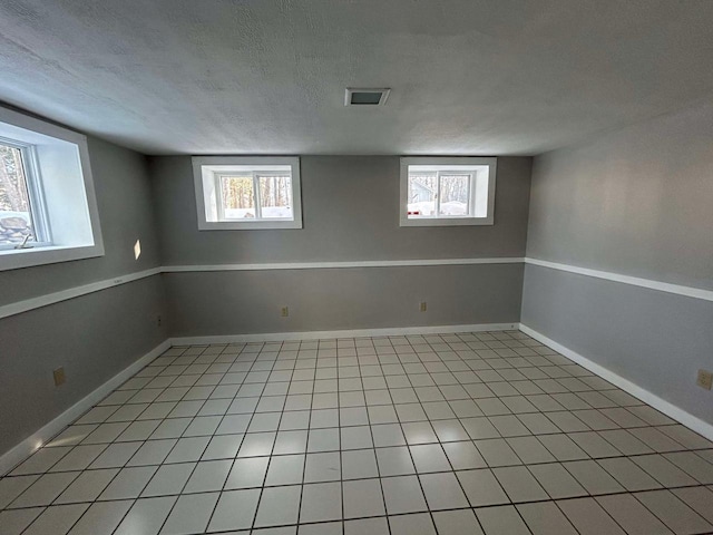 basement with a textured ceiling