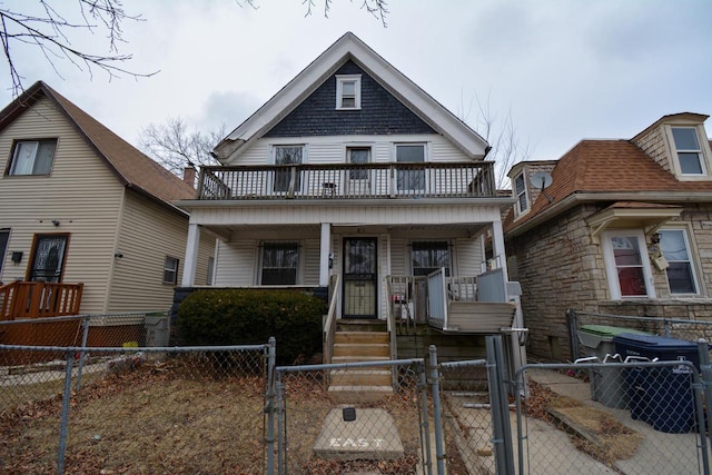 view of front of property featuring a balcony and a porch