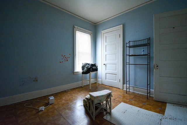 entrance foyer featuring parquet floors and ornamental molding