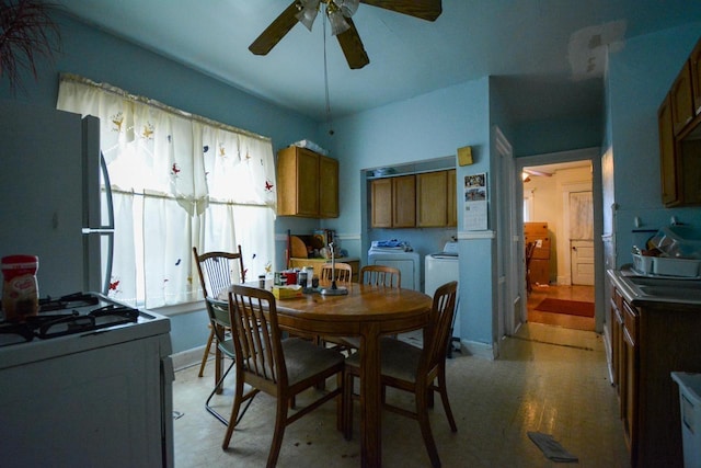 dining area featuring washing machine and dryer and ceiling fan