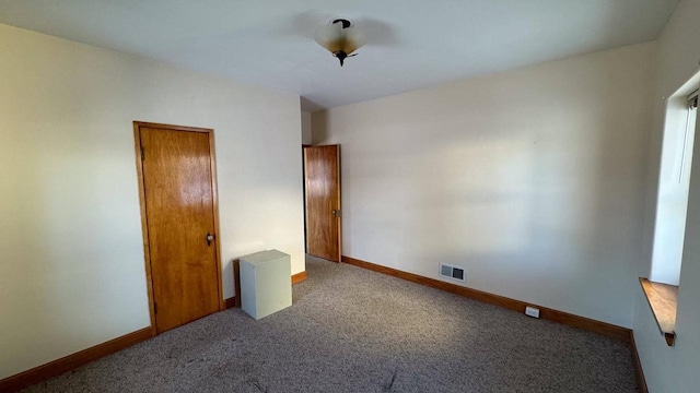 unfurnished bedroom featuring carpet floors