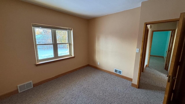 empty room featuring carpet flooring