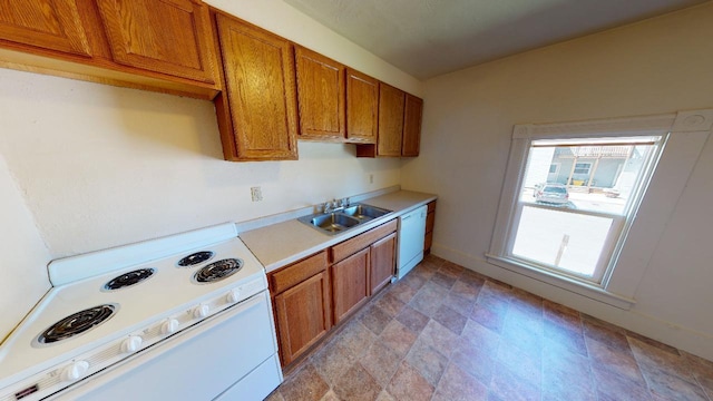 kitchen with sink and white appliances