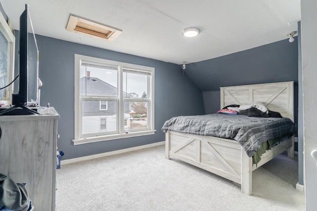 carpeted bedroom with vaulted ceiling