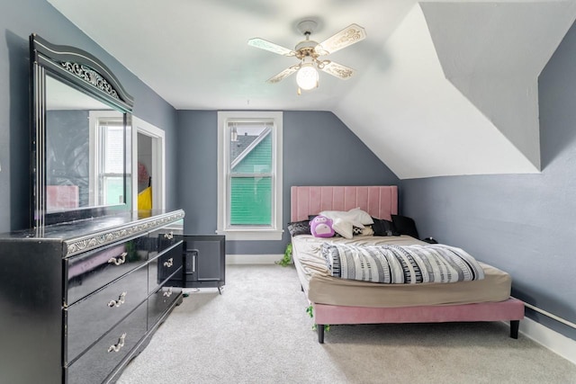 carpeted bedroom with ceiling fan and lofted ceiling