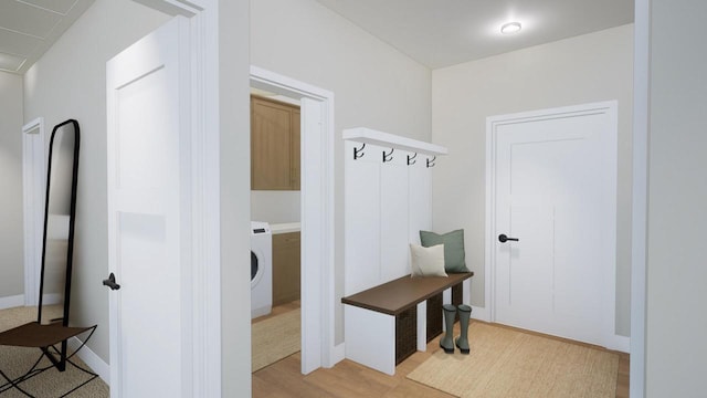 mudroom featuring washer / clothes dryer and light hardwood / wood-style floors