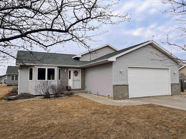 ranch-style house with a garage and a front yard