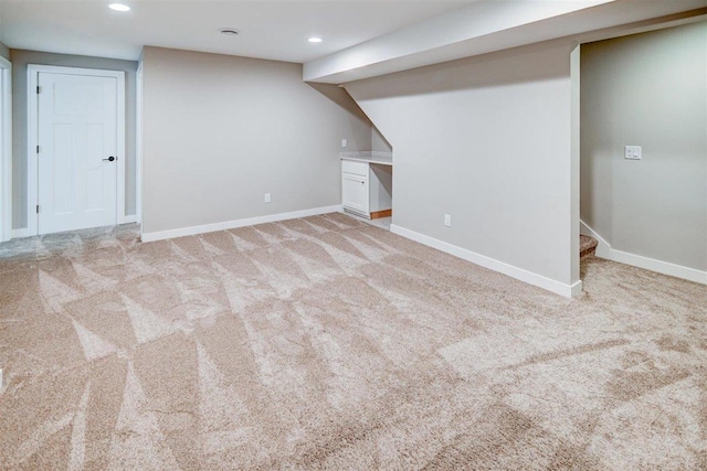 basement with light colored carpet