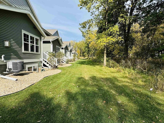 view of yard with central AC unit