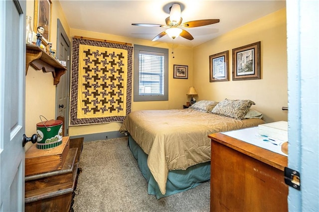 bedroom with ceiling fan and carpet