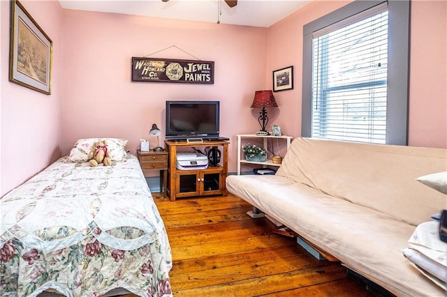 bedroom featuring wood-type flooring and ceiling fan