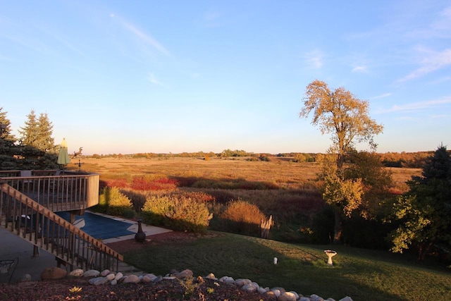 view of yard with a rural view