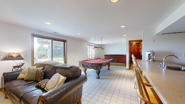 playroom featuring pool table, sink, and light tile patterned floors