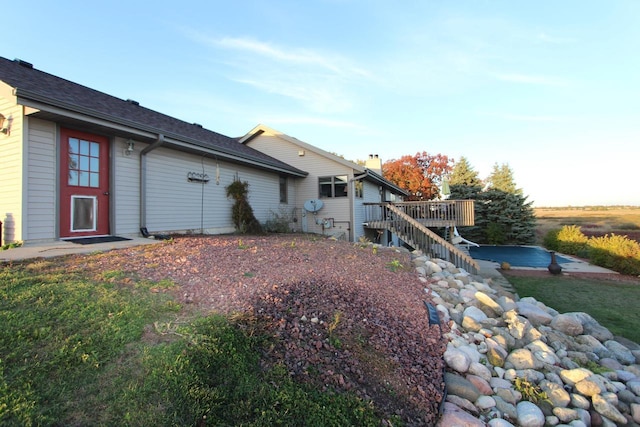 rear view of property with a deck