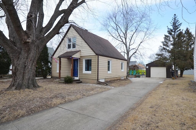 view of front of home with a garage and an outdoor structure