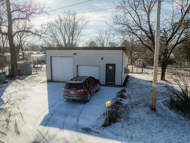 view of snow covered garage