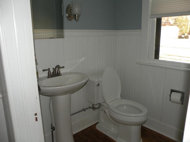 301 W Amelia St, Cassville, WI 53806 - bathroom featuring wood-type flooring, toilet, and sink