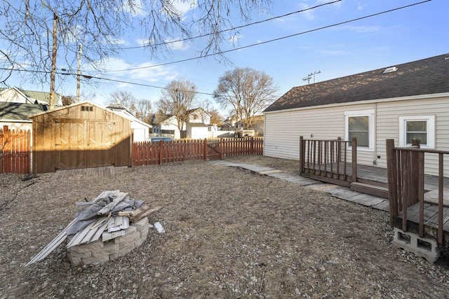 view of yard with a shed and a deck