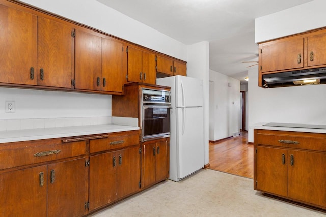 kitchen featuring ceiling fan and black appliances