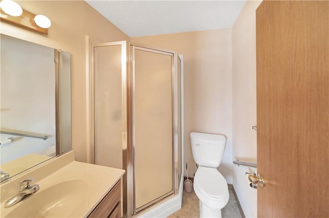 bathroom featuring an enclosed shower, vanity, tile patterned floors, and toilet