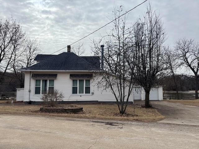 view of side of home with a garage