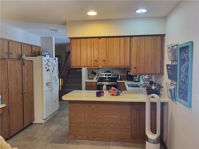 kitchen with stainless steel range with electric stovetop, white fridge with ice dispenser, kitchen peninsula, and light tile patterned flooring