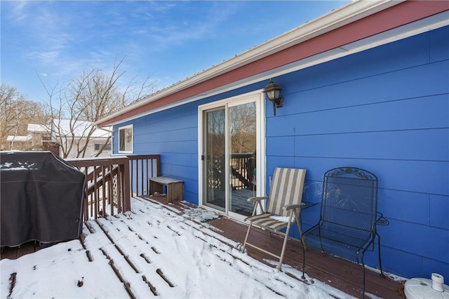 snow covered deck with area for grilling