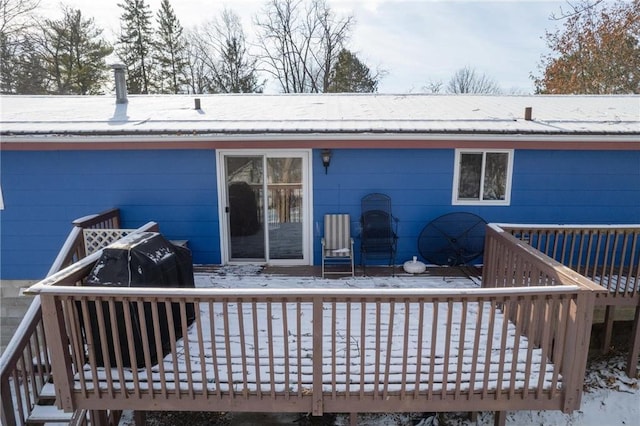 view of snow covered deck