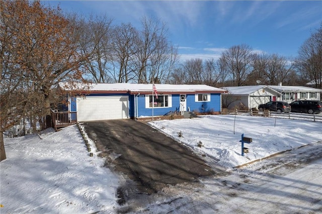 ranch-style home featuring a garage