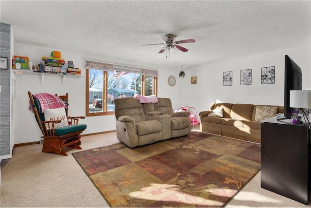 carpeted living room with a textured ceiling and ceiling fan